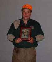 Jeff Olson taking 4th in the Top Gun Flusher Division at the 18th Annual US Open Pheasant Championship with Doc a six year old black 
lab.  Jeff and Doc harvested 4 pheasant in 2 minutes and 13 seconds.