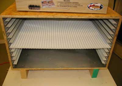 The racks I use are plastic. I spray them with non-stick cooking spray before using them.