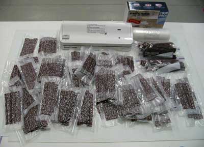 When finished, I take the long strips of jerky and cut them down to 5 1/2 inch lengths and vacuum seal the rest 