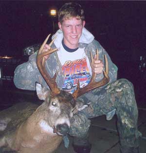 Jerrod Smith, age 17, first season bow hunting, 2nd time out, with a Martin Bow.
10 point buck, 212 lbs. field dressed, shot Sunday October 30. SE of Eau Claire, WI.
"Special thanks to Jeff and Jackson for helping him track it in the dark, and drag it back up to their vehicle.  Without them I would not have been in the woods."